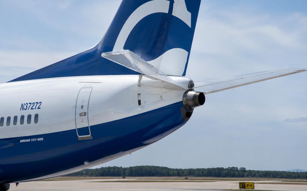 Tail with APU exhaust, rudder and stabilizer