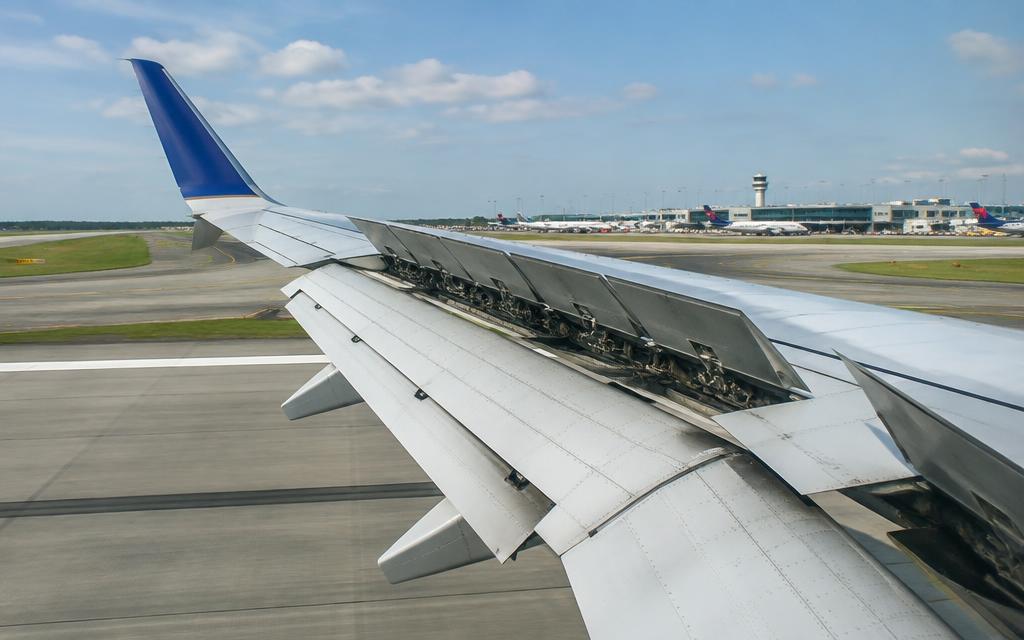Wing with winglet, spoilers, flaps and leading-edge devices