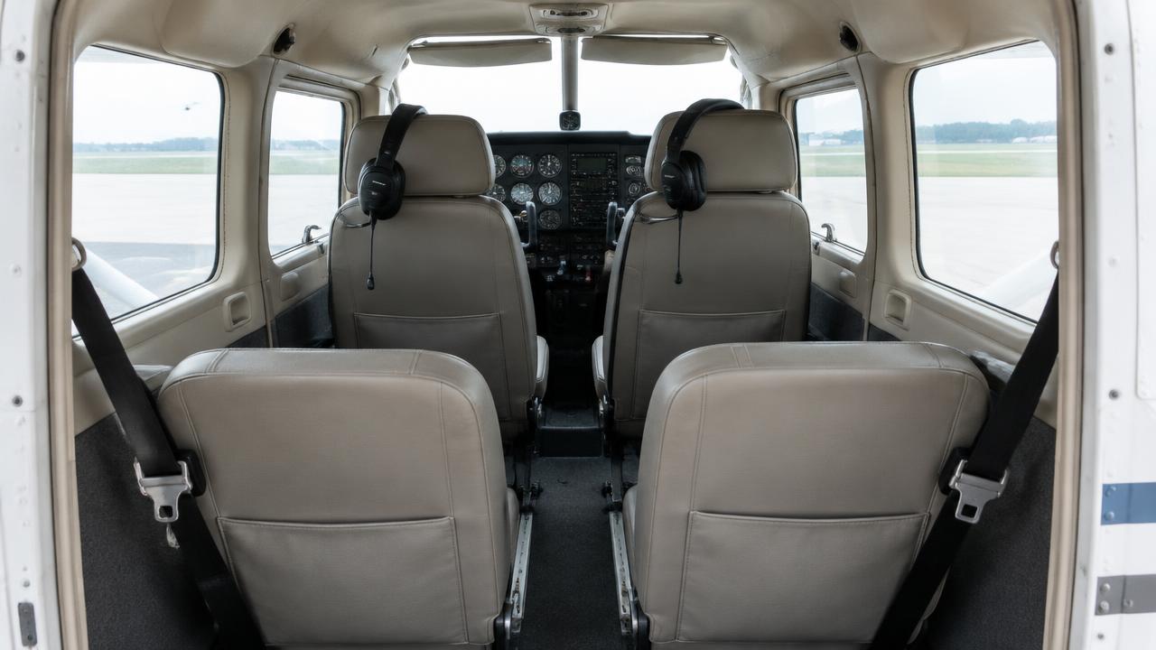 Four-seat cabin with harnesses and headsets